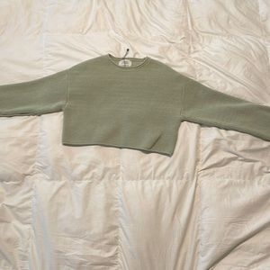 It is a crop top sweater from Zaria Size is 13/14 Green yellowish